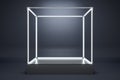 Blank illuminated glass showcase with mock up place on gray wall background.