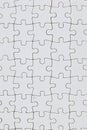 Blank interlocked jigsaw puzzle pieces arranged in grid pattern Royalty Free Stock Photo