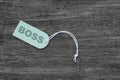 Blank label. With rope on wooden table. Sign that says Boss Royalty Free Stock Photo