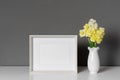 Blank landscape frame mockup with daffodils flowers