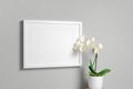 Blank landscape frame mockup with orchid flower