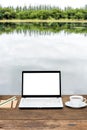 Blank laptop on wooden table