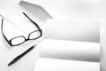 blank of letter paper and envelope with eyeglasses and pen Royalty Free Stock Photo