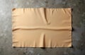 Blank light brown tablecloth on grey cement background. Empty space for design. Perspective view suitable for food presentation.