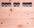 Blank light colored wood fills this template image with the word Not Me Too spelled out in blocks along the top