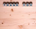 Blank light colored wood fills this template image with the words Thank You spelled out in blocks along the top