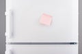 Blank light pink sticky paper note on white refrigerator Royalty Free Stock Photo