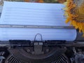 Blank line note paper on an old typewriter retro vintage with wilted sunflower. Life story concept Royalty Free Stock Photo