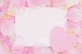 Blank love greeting card on pink rose flower petals Royalty Free Stock Photo