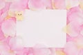 Blank love greeting card on pink rose flower petals Royalty Free Stock Photo