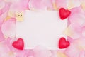 Blank love greeting card on pink rose flower petals Royalty Free Stock Photo