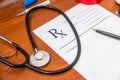 Blank medical prescription with stethoscope, pills, pen Royalty Free Stock Photo