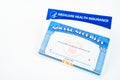 Blank Medicare health insurance and social security card isolated on white Royalty Free Stock Photo