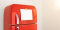 Blank memo note sticker on red refrigerator close up. blank paper reminder on red retro fridge door close up