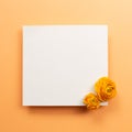 Blank memo pad with dry flowers on orange background Royalty Free Stock Photo