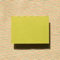 Blank memo pad, empty paper on fabric background Royalty Free Stock Photo