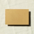 Blank memo pad, empty paper on fabric background Royalty Free Stock Photo