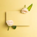 Blank memo pad with rose flowers on yellow gold background Royalty Free Stock Photo