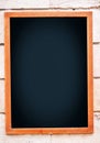 Blank menu board hanging on wall Royalty Free Stock Photo