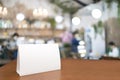 Blank menu frame label mockup. Mock up menu frame on table in bar restaurant, stand for booklet with white sheet of acrylic tent Royalty Free Stock Photo