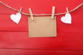 Blank message card and felt hearts with clothespins Royalty Free Stock Photo