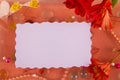 Blank message note for your text on underwater background. Red, white flowers, perl beads, different decoration in light red water