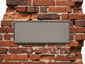 Blank metal plaque on brick wall isolated on white background Royalty Free Stock Photo