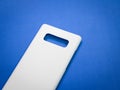 Blank mobile case on blue background. Smart phone cover for your design Royalty Free Stock Photo