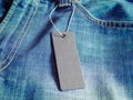 Blank mock-up label tag on clothes. Royalty Free Stock Photo