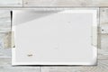 Blank mock-up torn sheet paper frame reminder glued with adhesive tape to white wooden textured wall Royalty Free Stock Photo