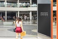 Blank mock up of vertical street poster  advertising billboard in the city for your advertising with blur people in action, Empty Royalty Free Stock Photo