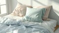 Blank mockup of soft pastelcolored bed sheets on a cozy single bed. Royalty Free Stock Photo