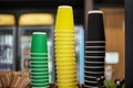 Blank mockup, three stacks of colored paper cups, green yellow black cup different sizes for hot drinks coffee or tea Royalty Free Stock Photo