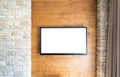 Blank modern flat screen TV at the brick and wooden wall with copy space Royalty Free Stock Photo