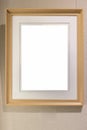 Blank modern wooden picture frame on wall Royalty Free Stock Photo