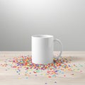 Blank Mug surrounded by Bright Confetti Royalty Free Stock Photo