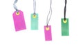 Blank multicolored labels tags made of cardboard or price notes of pink and green color isolated on white background.