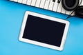 Blank music tablet screen with Music keyboard and headphone Royalty Free Stock Photo