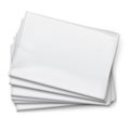 Blank newspapers pile on white background.