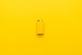 Blank nine-volt battery on the yellow background Royalty Free Stock Photo