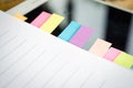 Blank note book with colorfull post it on wood table Royalty Free Stock Photo
