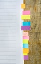 Blank note book with colorfull post it on wood table Royalty Free Stock Photo