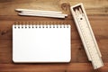 Blank note book ,pencils ,ruler and pencil box on wood background Royalty Free Stock Photo