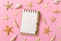 Blank note book with starfish or seashells on a pink background , summer vaction concept Royalty Free Stock Photo