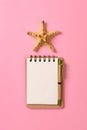 Blank note book with starfish or seashells on a pink background , summer vaction concept Royalty Free Stock Photo