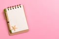 Blank note book with starfish or seashells on a pink background , summer vaction concept Royalty Free Stock Photo