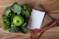 Blank note pad and the Healthy fresh green smoothie juice in