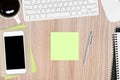 Blank note paper with pen is on top of wood office table. Top view, flat lay Royalty Free Stock Photo
