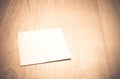 Blank Note paper on wooden table with vintage filter Royalty Free Stock Photo