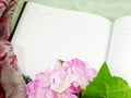 Blank notebook with beautiful artificial flower Royalty Free Stock Photo